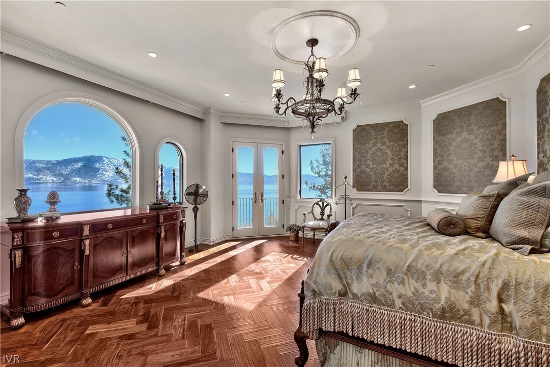 32 Crystal Drive Crystal Bay, NV 89402 - Photo 15 of 35 a bedroom with a large bed and a chandelier