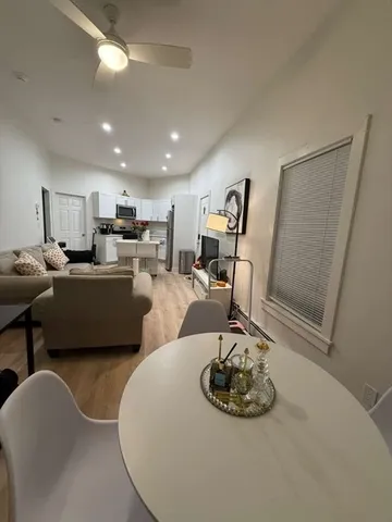 a living room with furniture and a table