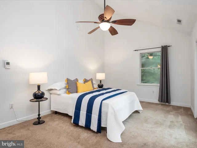 a white toilet sitting next to a shower curtain