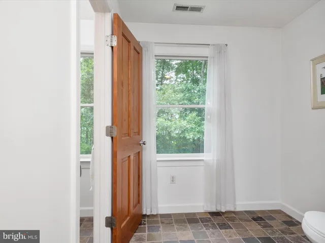 a view of a workspace with furniture
