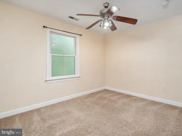 a front view of house with yard and outdoor seating