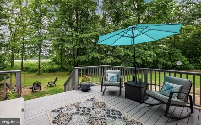 a view of a house with a yard and a large window
