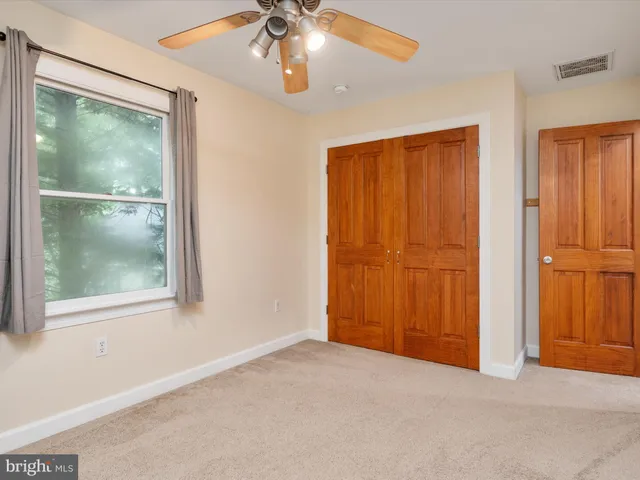 a view of a field with an ocean view