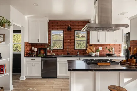 a bedroom with bed and wooden floor