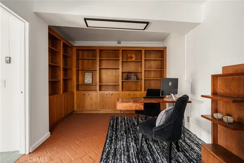a view of a chairs and table in a balcony