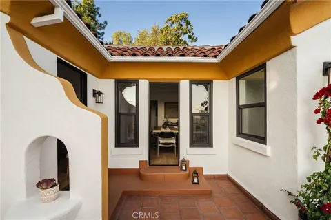 a view of outdoor space with wooden floor and city view