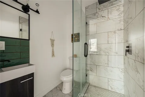 a view of a livingroom with furniture window and wooden floor