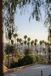 a view of a dining room with furniture and a flat screen tv