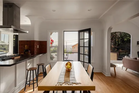 a kitchen with stainless steel appliances a sink stove and cabinets
