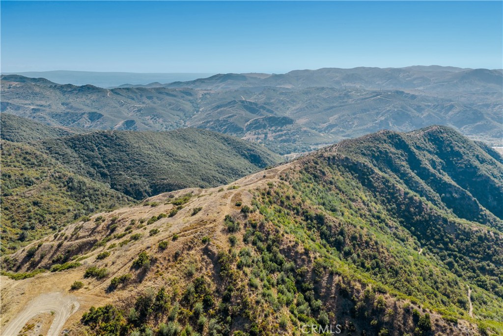 1 Williams Canyon Road Silverado, CA 92676 - Photo 6 of 15 a view of a dry yard with mountains in the background