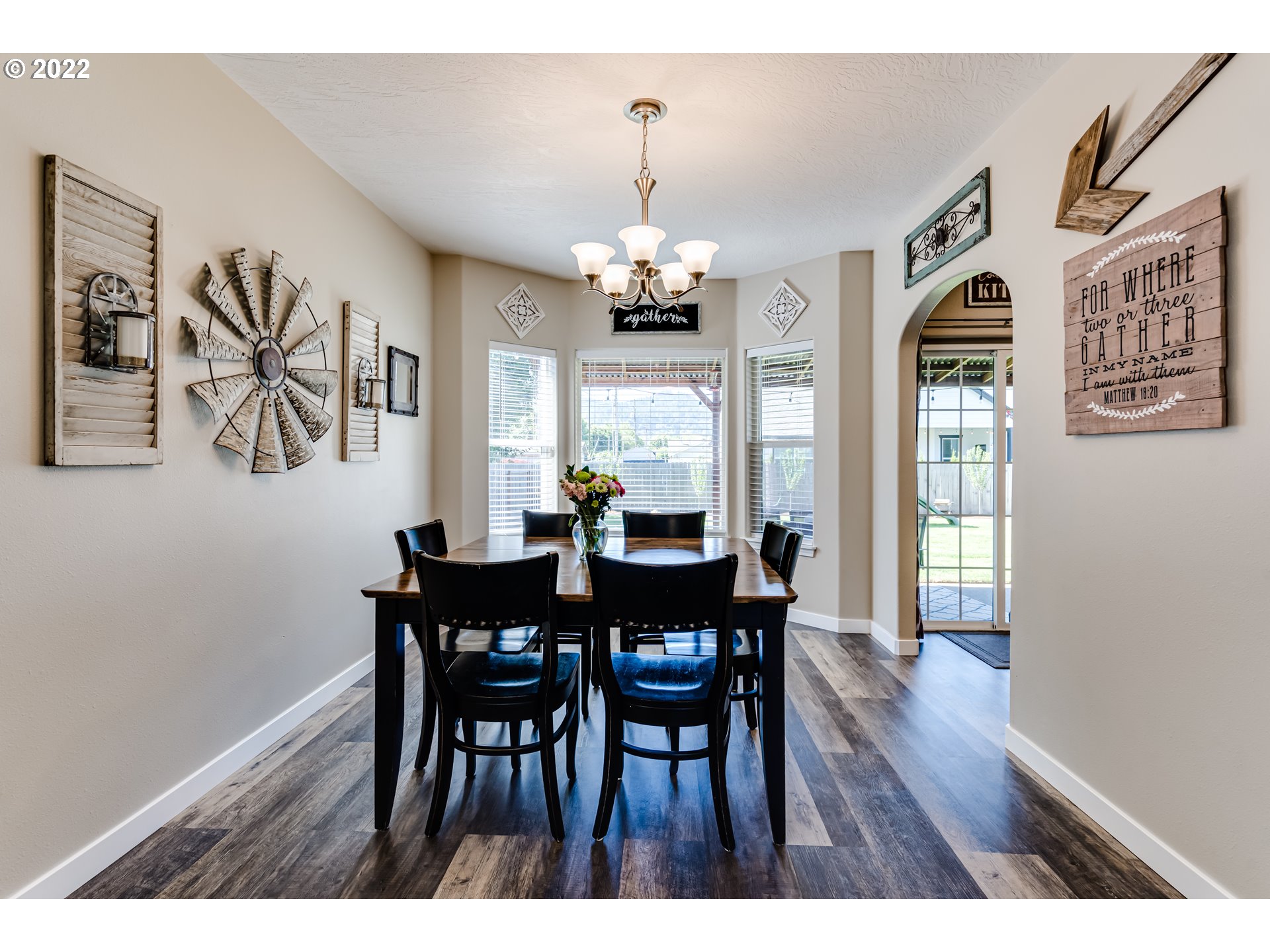 4031 North Street Springfield, OR 97478 - Photo 8 of 31 a view of a dining room with furniture window and wooden floor