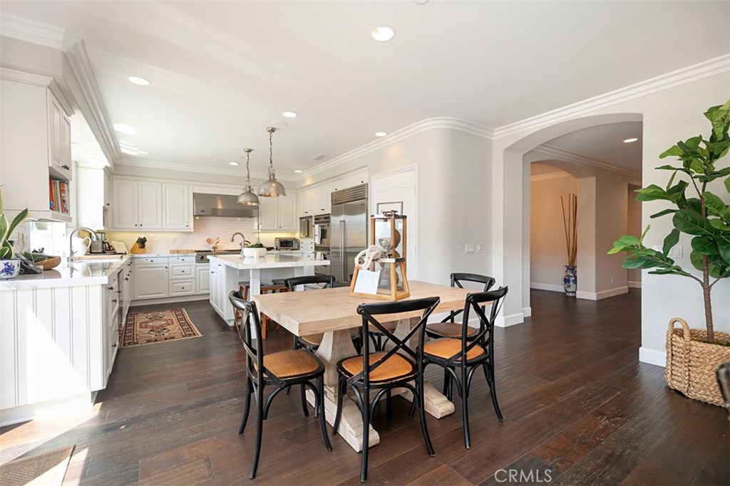 27 Via Monarca Street Dana Point, CA 92629 - Photo 19 of 62 a view of a dining room and livingroom with furniture wooden floor a chandelier