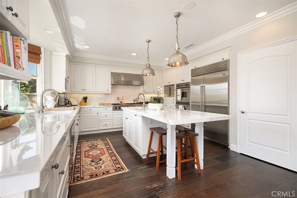 27 Via Monarca Street Dana Point, CA 92629 - Photo 23 of 62 a kitchen with white cabinets and white appliances