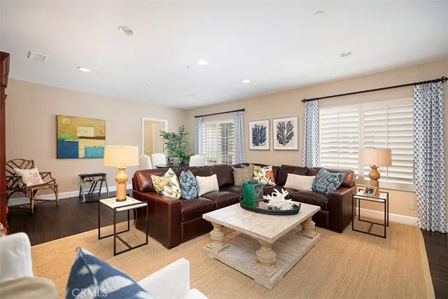 a spacious bedroom with bed tv and window