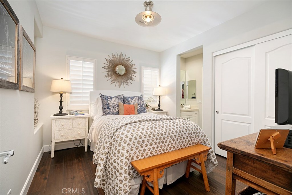 27 Via Monarca Street Dana Point, CA 92629 - Photo 38 of 62 a bedroom with a bed and a chandelier