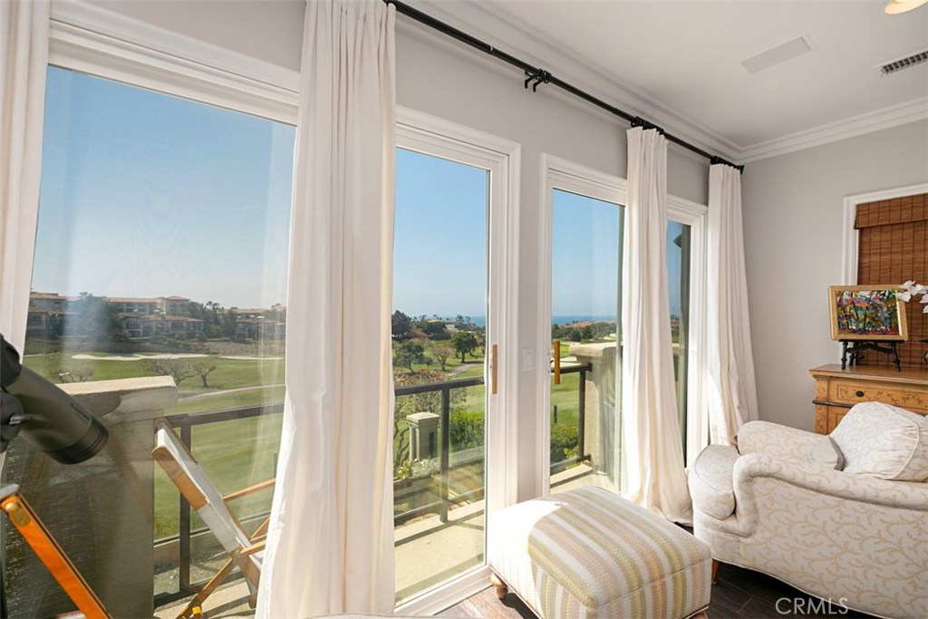 27 Via Monarca Street Dana Point, CA 92629 - Photo 46 of 62 a living room with furniture and a floor to ceiling window