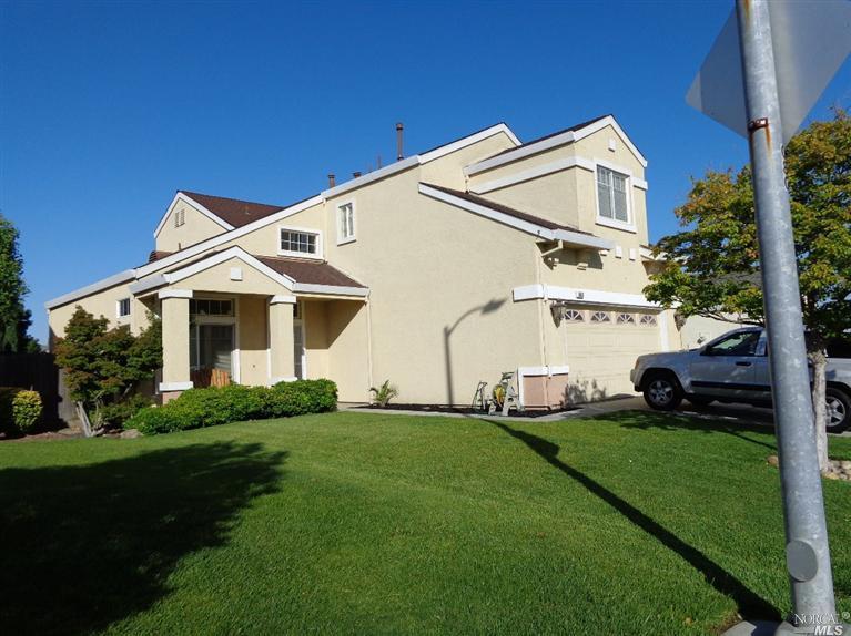 663 Madere Way Rio Vista, CA 94571 - Photo 1 of 1 a view of a white house next to a yard with big trees