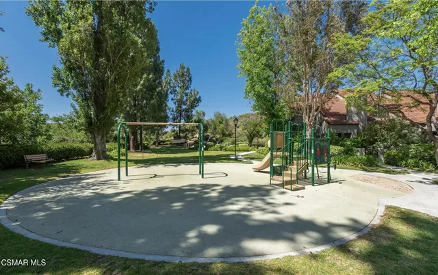 a view of a park with swings