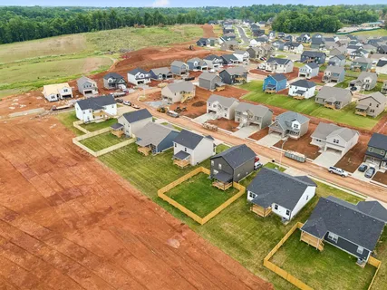 an aerial view of a house with a garden