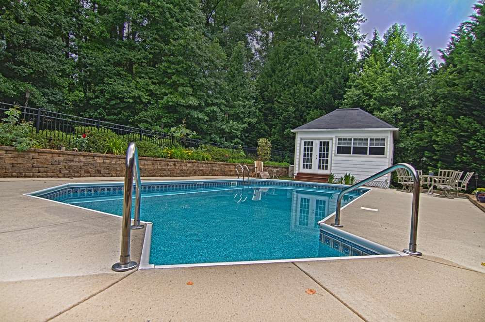 Beautiful pool with pool house for easy storage pool
