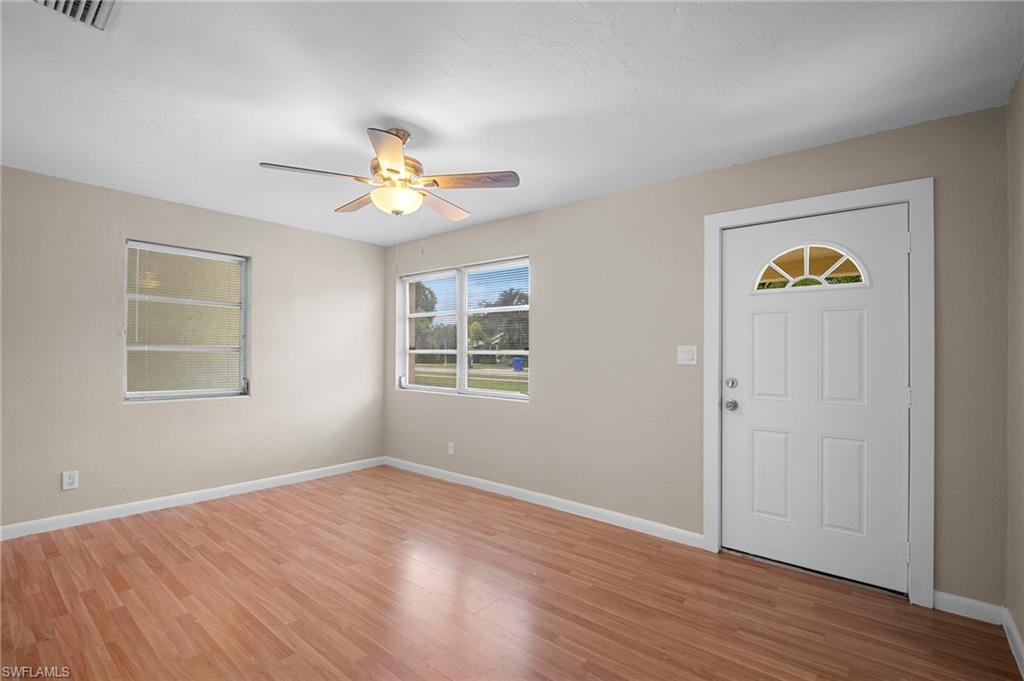1758 Coronado Road Fort Myers, FL 33901 - Photo 3 of 12 Entrance foyer with light wood finished floors and a ceiling fan