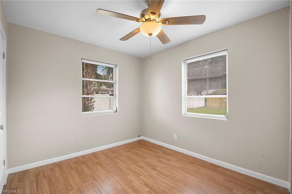 1758 Coronado Road Fort Myers, FL 33901 - Photo 9 of 12 Empty room featuring light wood-type flooring and a ceiling fan