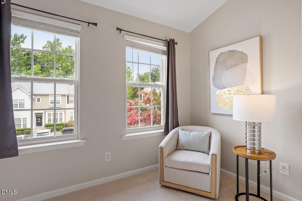 7734 Winners Edge Street Raleigh, NC 27617 - Photo 19 of 37 a living room with furniture and a window