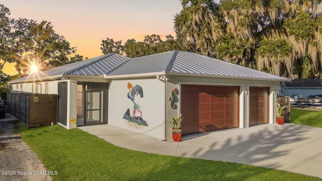 a front view of a house with a yard and porch