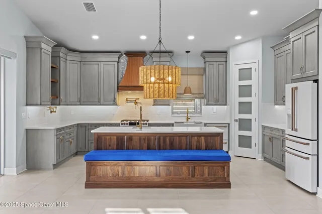 a living room with hardwood floor and a large window