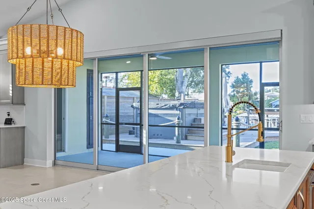 a view of an empty room with a cabinet and a flat screen tv