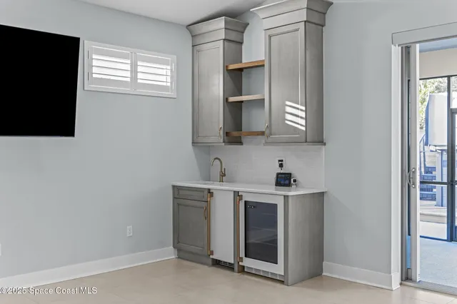 a view of an empty room with a large window and an outdoor view