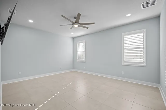 a room with water heater and racks on the wall