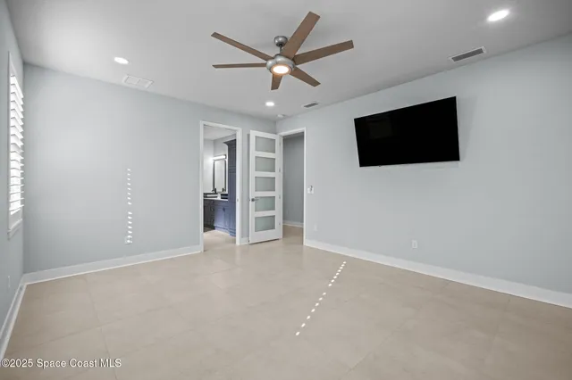 a view of a patio with table and chairs with wooden floor and fence