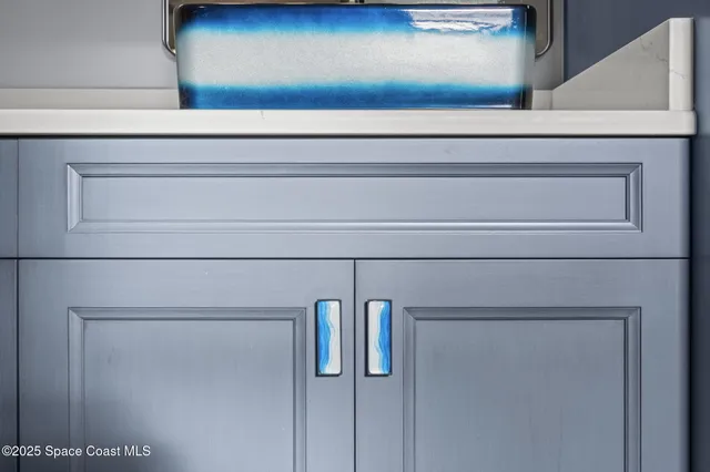 a view of a chairs and table on the roof deck