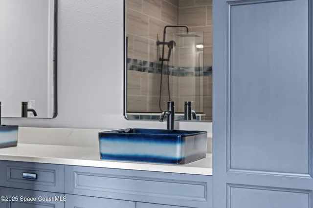 a view of a patio with chairs and table on the wooden floor
