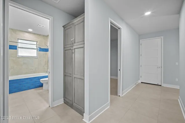 an aerial view of residential building and ocean