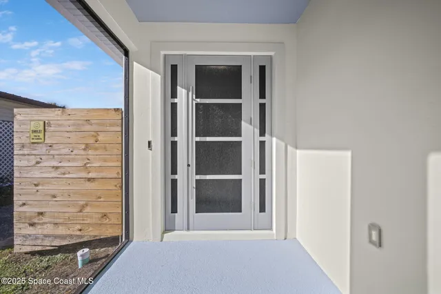a kitchen with kitchen island granite countertop a sink stainless steel appliances and cabinets