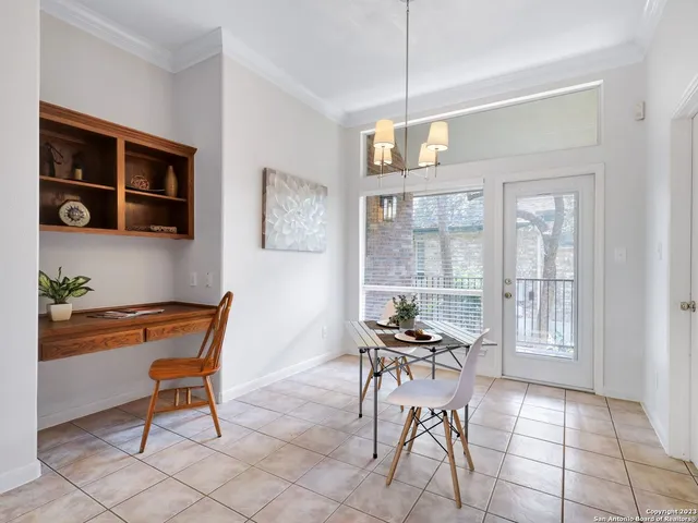 a work room with furniture and wooden floor