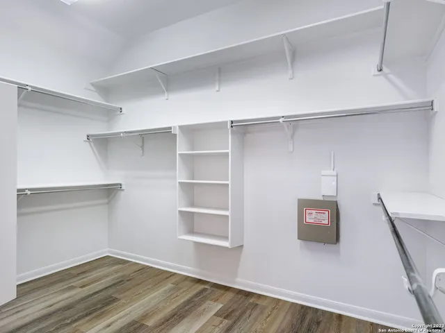 a view of a room with shelf on the wall