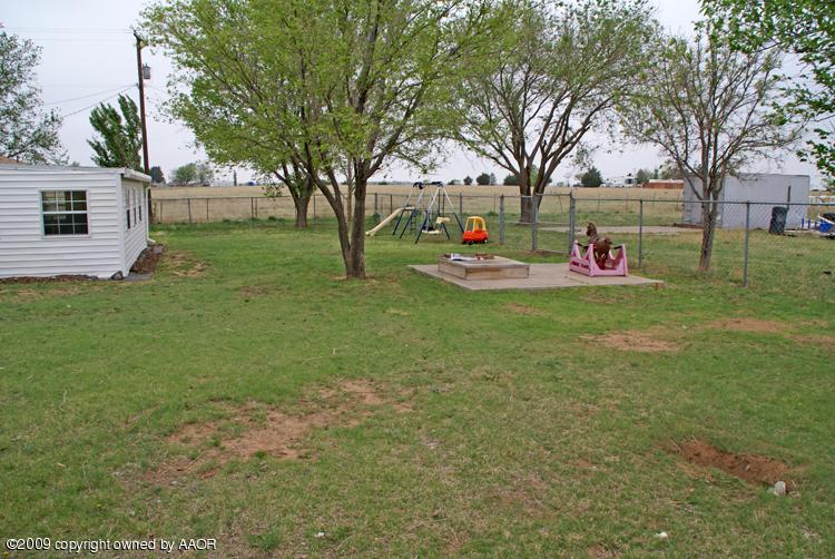 201 East Plantation Road Amarillo, TX 79118 - Photo 11 of 12 a view of a house with backyard and tree