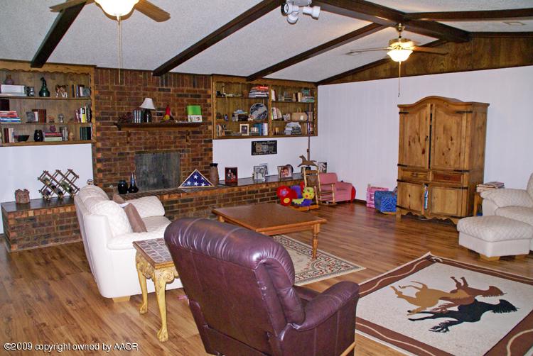 201 East Plantation Road Amarillo, TX 79118 - Photo 2 of 12 a room with furniture and wooden floor