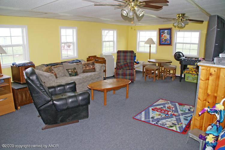 201 East Plantation Road Amarillo, TX 79118 - Photo 5 of 12 a living room with furniture and a large window
