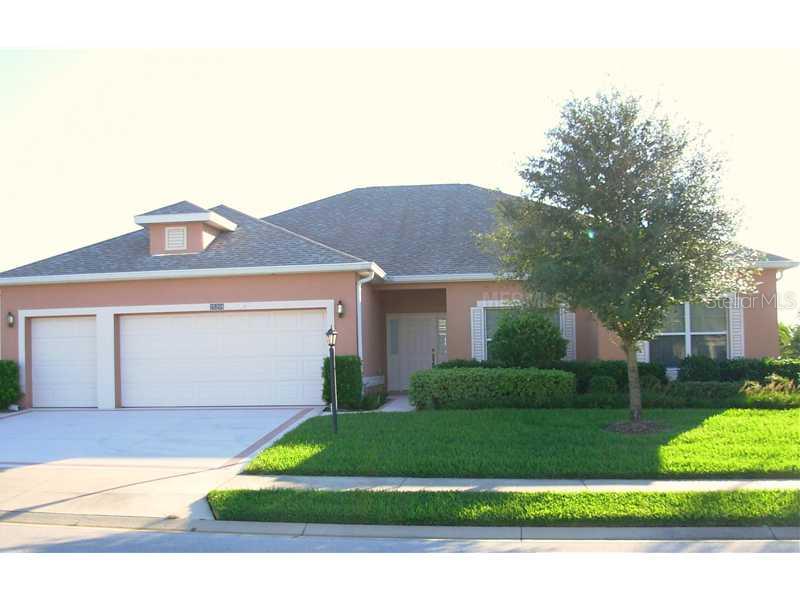 25208 Laurel Valley Road Leesburg, FL 34748 - Photo 1 of 1 a front view of a house with a yard and garage