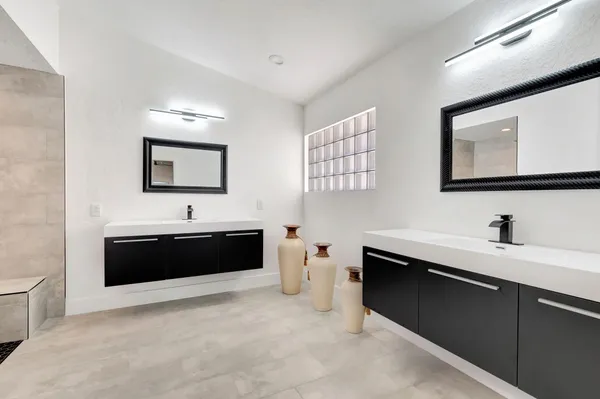 a bathroom with a sink a toilet and bathtub