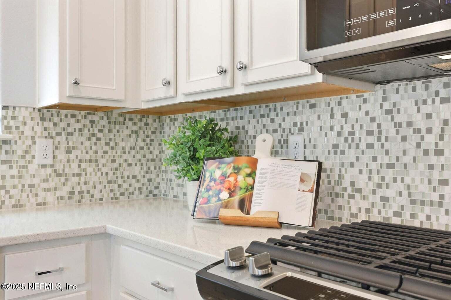 251 Rambling Brk Trail St. Johns, FL 32259 - Photo 14 of 40 a close view of a stove in the kitchen