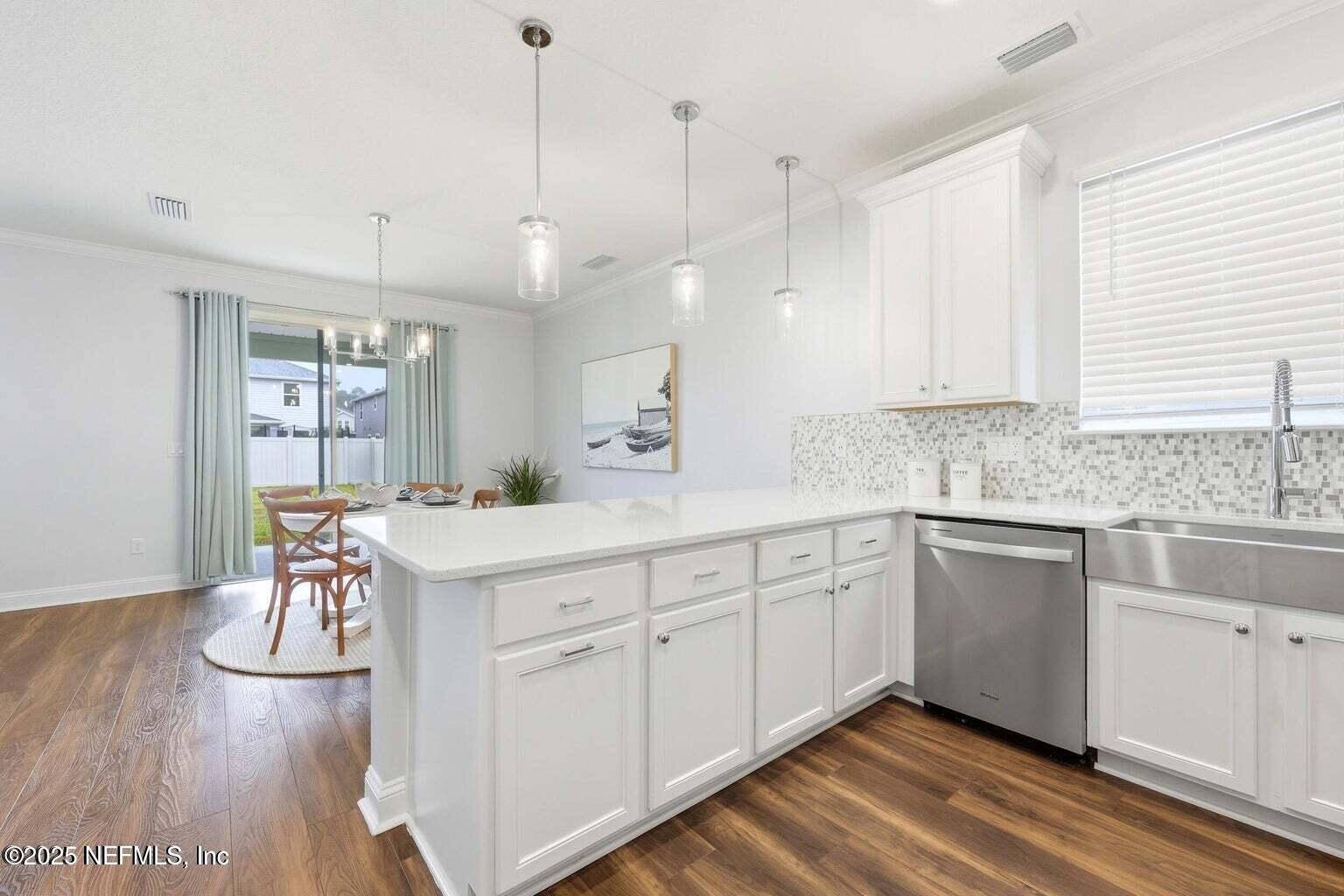 251 Rambling Brk Trail St. Johns, FL 32259 - Photo 15 of 40 a kitchen with white cabinets and sink