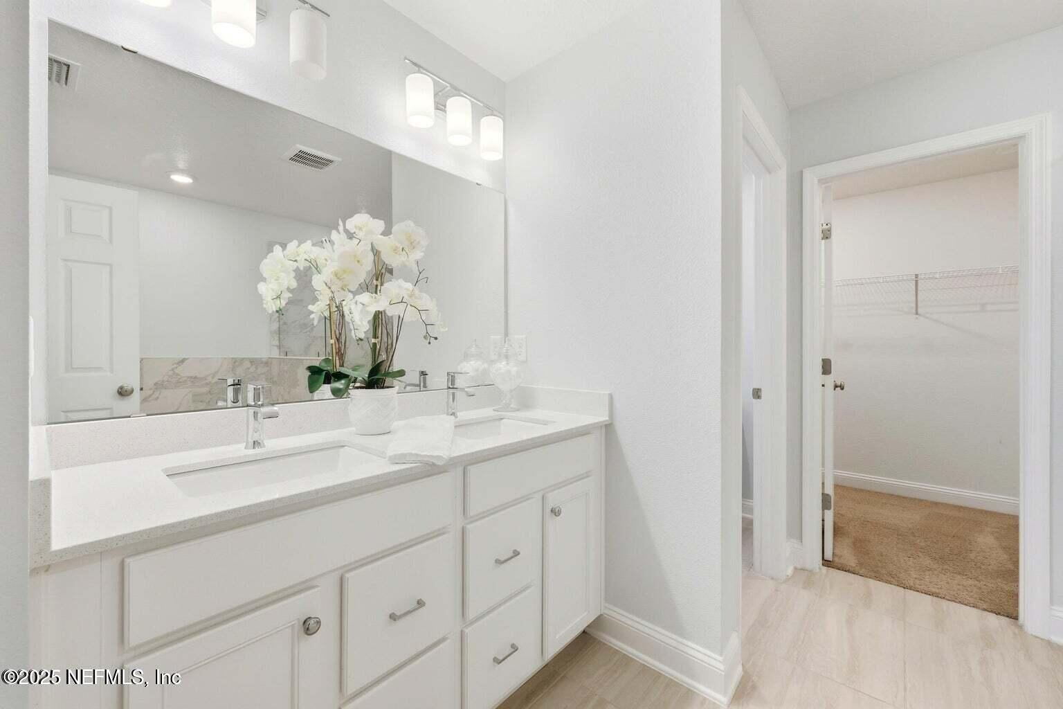 251 Rambling Brk Trail St. Johns, FL 32259 - Photo 23 of 40 a bathroom with a sink and a mirror