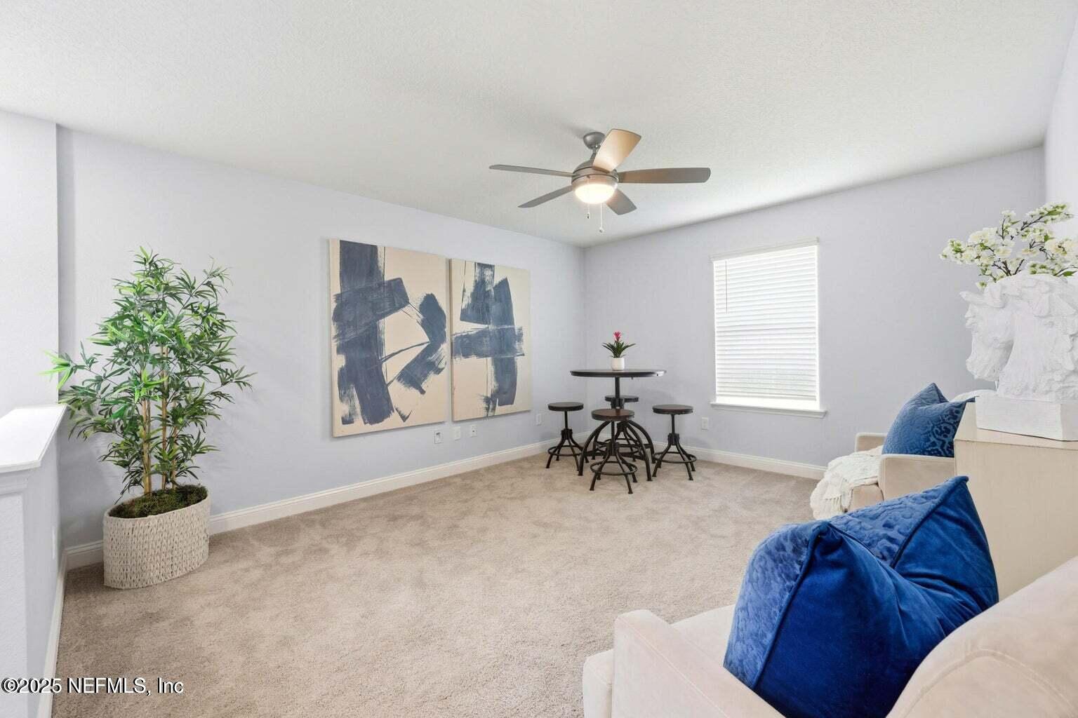 251 Rambling Brk Trail St. Johns, FL 32259 - Photo 35 of 40 a view of a livingroom with furniture and a potted plant