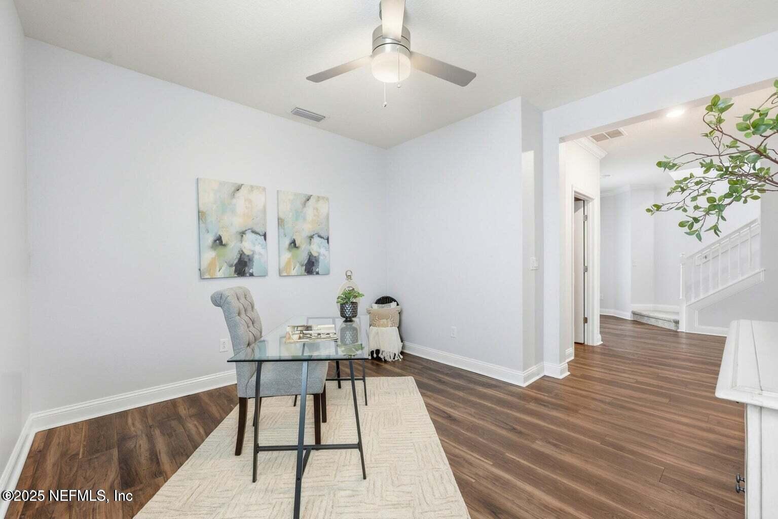 251 Rambling Brk Trail St. Johns, FL 32259 - Photo 38 of 40 a workspace with wooden floor and a potted plant