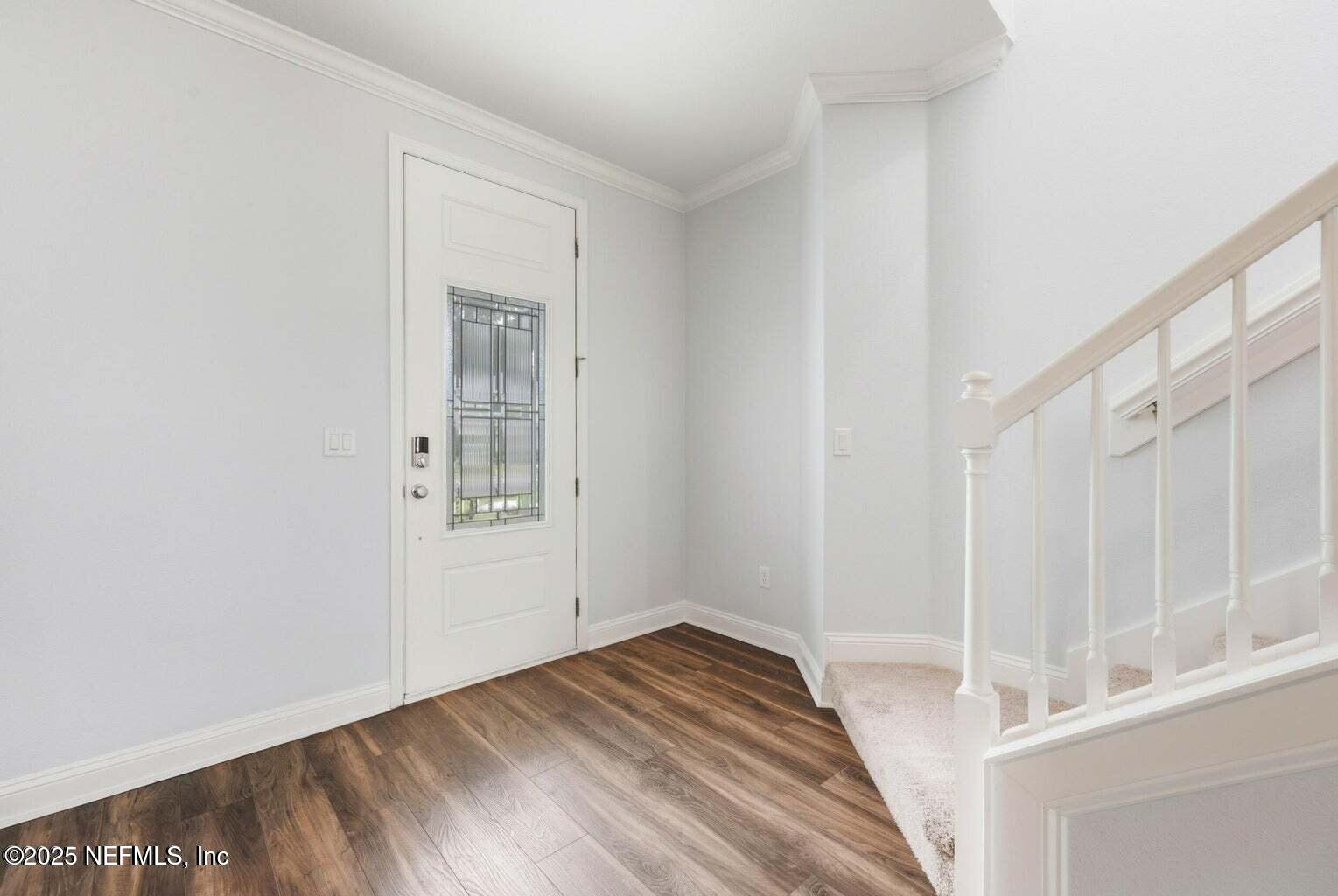 251 Rambling Brk Trail St. Johns, FL 32259 - Photo 4 of 40 a view of a hallway with wooden floor and entryway